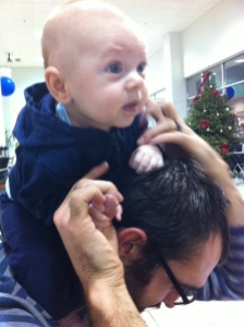 If you look carefully, you can see him drooling on daddy's head.